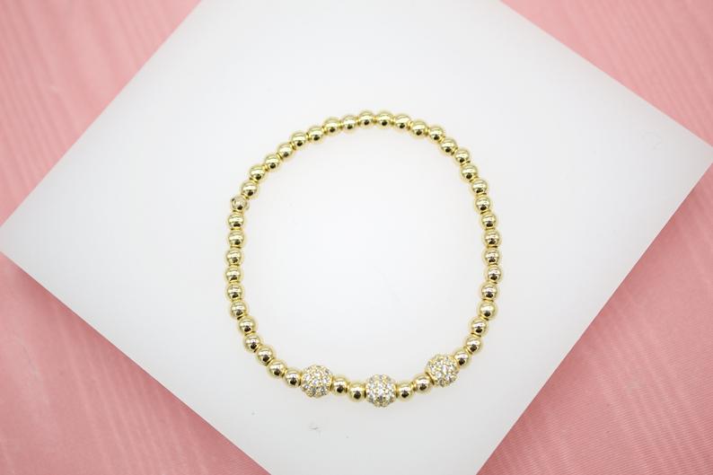 18K Gold Filled 4mm Gold Elastic Bead Bracelet With Three Round CZ Charm  (I30)